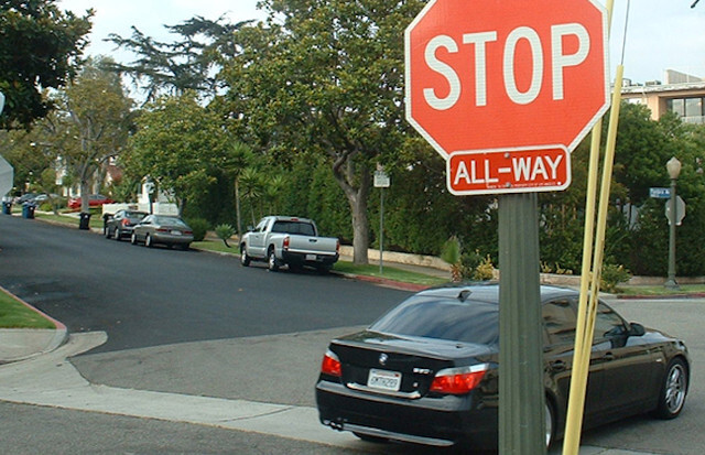 car at 4 ways stop signs intersection